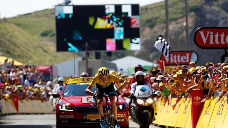 Froome approaches the finish line, extending his overall race lead to almost three minutes