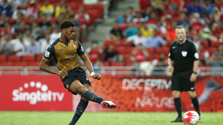 Akpom scores the second of his three goals in Arsenal's pre-season clash with Singapore Select XI