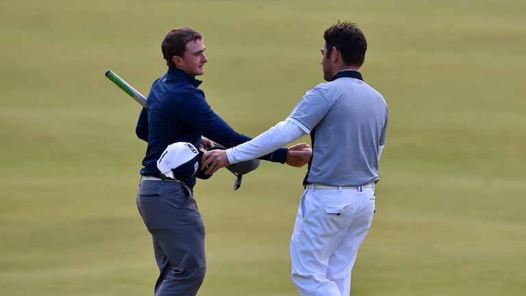 Paul Dunne shakes Louis Oosthuizen's hand after the pair enjoyed fine third rounds at St Andrews