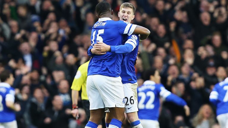 John Stones and former Everton team-mate Sylvain Distin celebrate last season