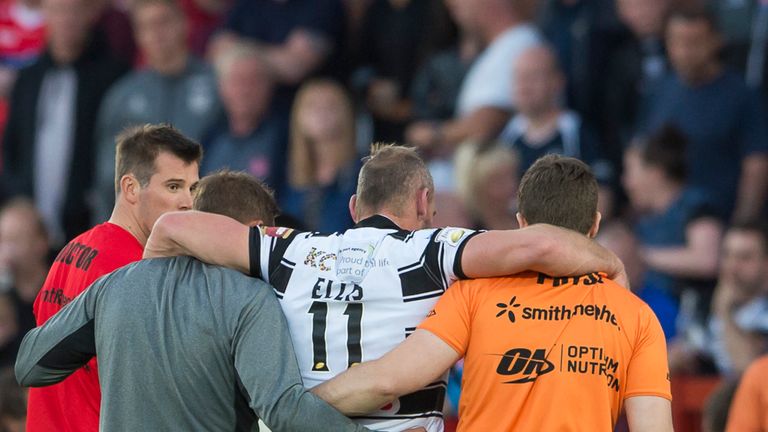 Hull FC captain Gareth Ellis is helped off after suffering a snapped Achilles
