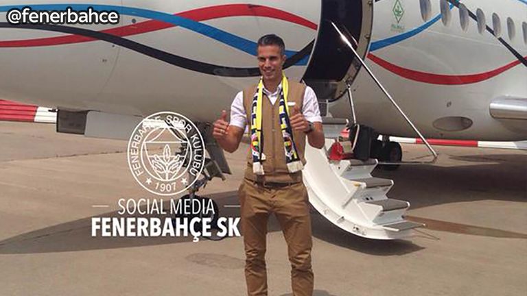 Robin van Persie - on his way to Turkey wearing a 'Fener' scarf