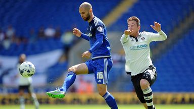 Image of Cardiff defender Matthew Connolly (left) battles Fulham's Ross McCormack for possession