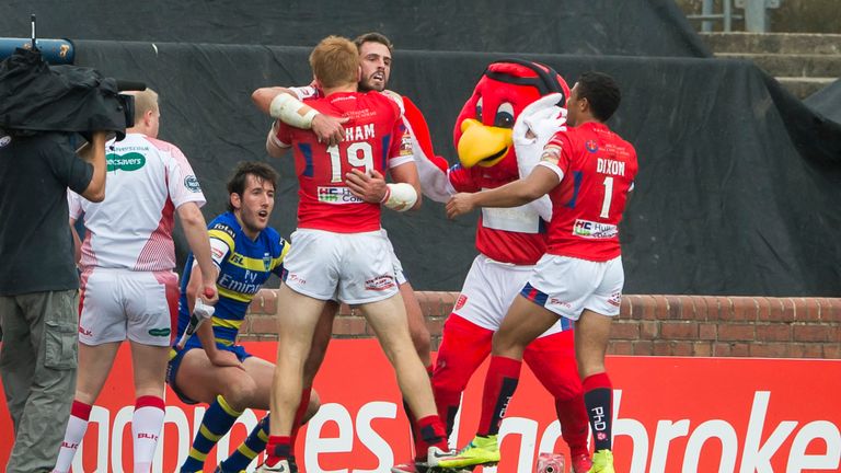 Hull KR's Josh Mantellato (middle) is congratulated by Kris Welham (No 19) on scoring his side's first try