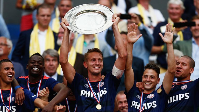 Luuk de Jong (middle) holds the Johan Cruijff Shield aloft