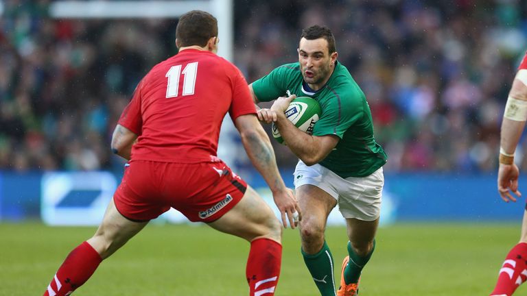 Dave Kearney runs at George North during Ireland's Six Nations win over Wales in 2014