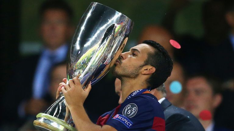 Pedro kisses the UEFA Super Cup trophy after his extra-time goal defeated Sevilla