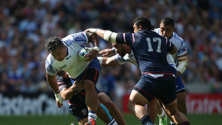 Census Johnston of Samoa drives past Oli Kilifi of the United States