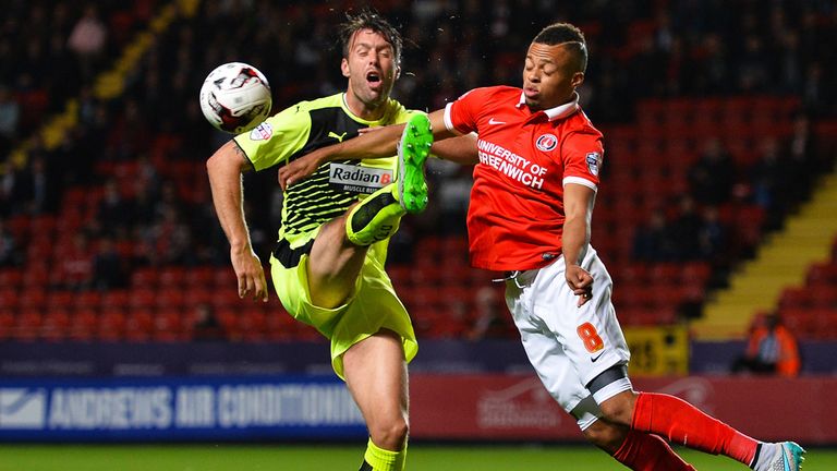 Elliott Ward of Huddersfield Town and Jordan Cousins of Charlton battle for the ball