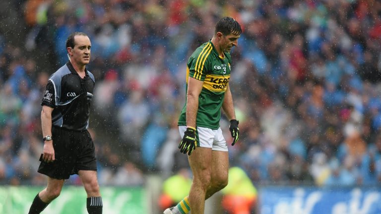 Aidan O'Mahony leaves the field after being black-carded by referee David Coldrick