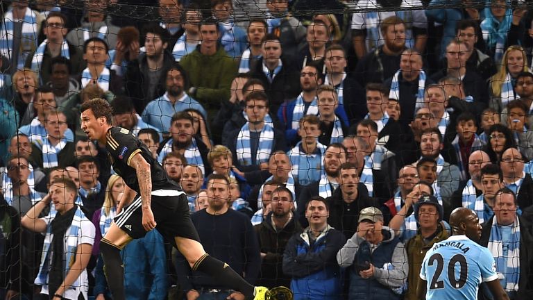Mario Mandzukic (left) celebrates after drawing Juventus level