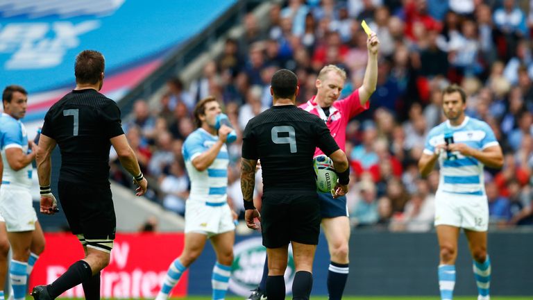 Wayne Barnes shows Richie McCaw a yellow card during the Pool C match between New Zealand and Argentina