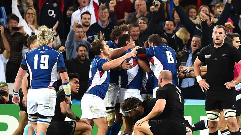 Namibia's players celebrate after scoring a try against New Zealand