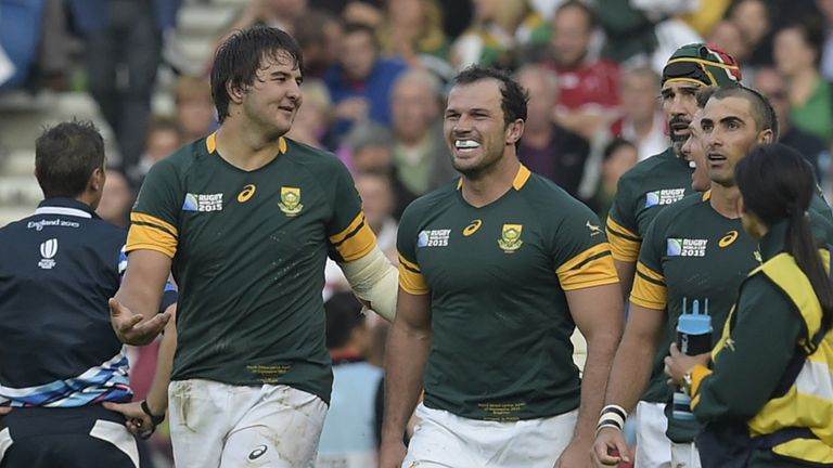 South Africa's lock Lood de Jager (L) celebrates after scoring a try against Japan