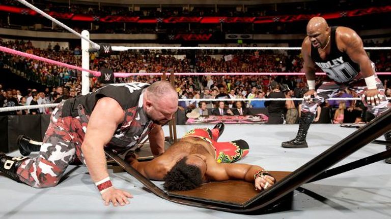 The Dudley Boyz survey the wreckage after putting Xavier Woods through a table