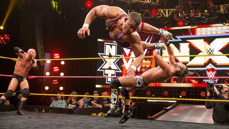 Jason Jordan spins into Jonny Gargano during a tag-team tussle