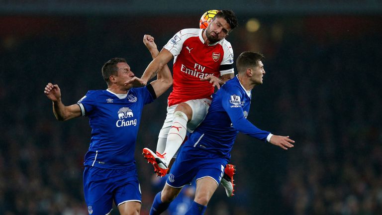 Olivier Giroud, Phil Jagielka and John Stones battle for the ball