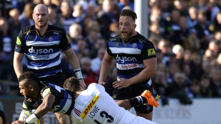 Bath's Niko Matawalu  is tackled by Harlequins centre George Lowe