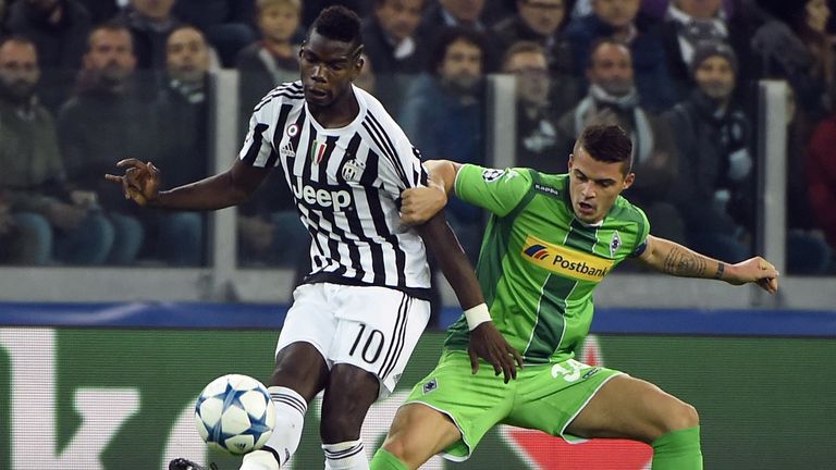 Paul Pogba vies with Xhaka in the Champions League