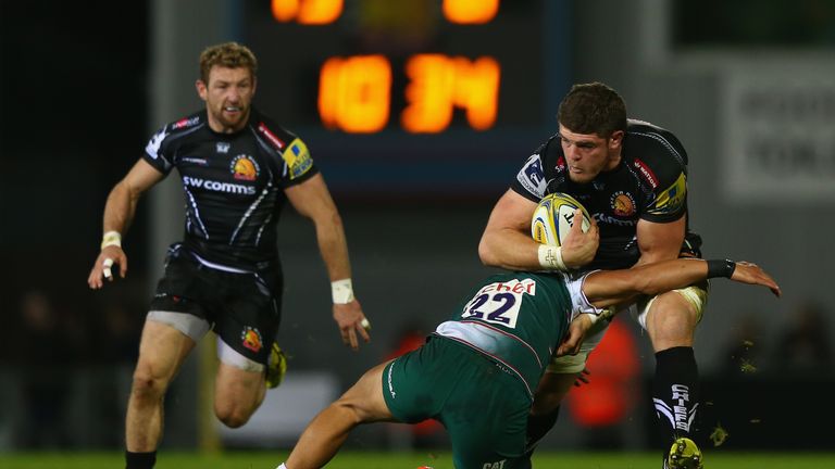 Exeter's Dave Ewers (right) powers past Leicester's Peter Betham 
