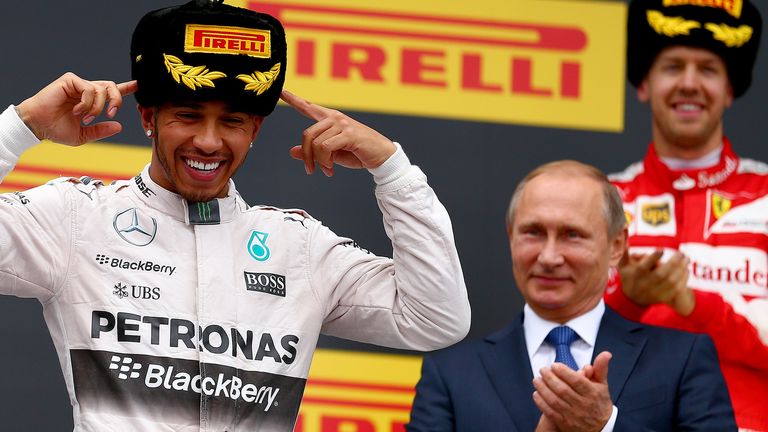 The main man: Sebastian Vettel and Vladimir Putin applaud Lewis Hamilton as he celebrates winning the Russian GP - Picture by Dan Istitene, Getty Images