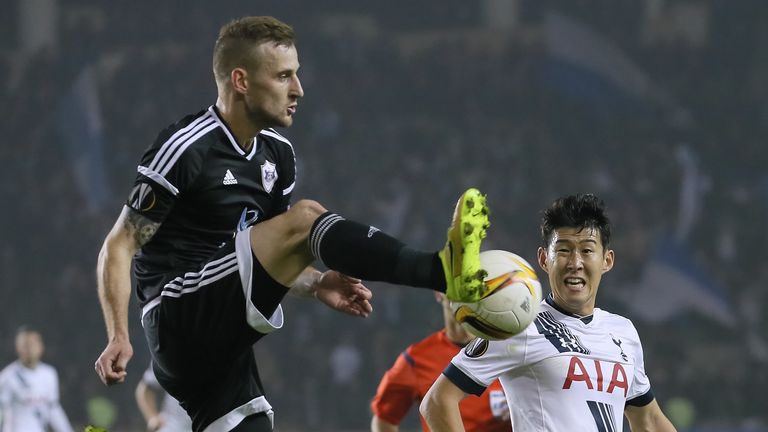 Maksim Medvedev of Qarabag is challenged by Son Heung-min