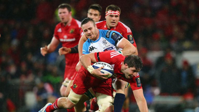 Dave O'Callaghan stumbles past Abraham Steyn at Thomond Park