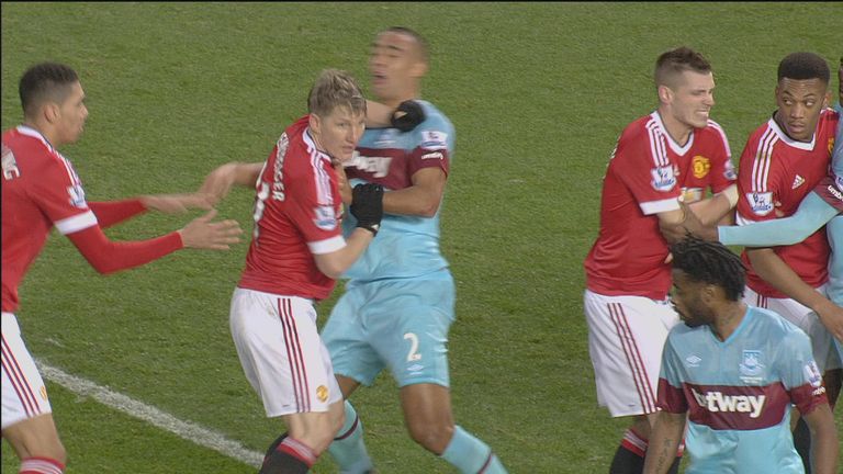 Schweinsteiger (2nd left) clashes with Winston Reid at Old Trafford