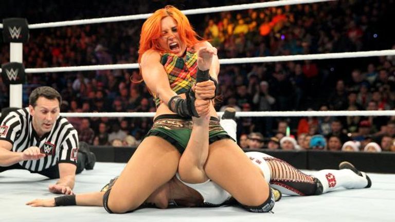 Becky Lynch catches Brie Bella in the Dis-arm-her