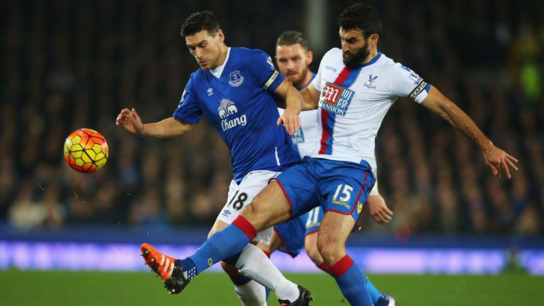 Gareth Barry challenges Mile Jedinak