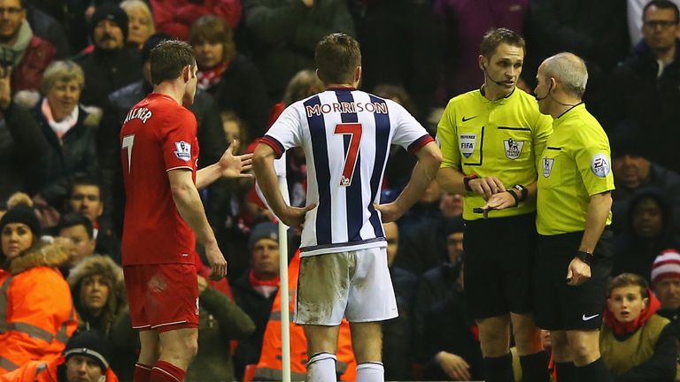 James Milner and James Morrison look on as the officials deliberate over the controversial offside decision