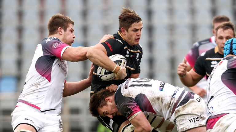 Zebre's Johan Meyer tackled by Jeff Hassler of Ospreys