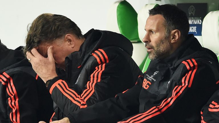 A dejected Manchester United manager Louis van Gaal (left) with assistant Ryan Giggs