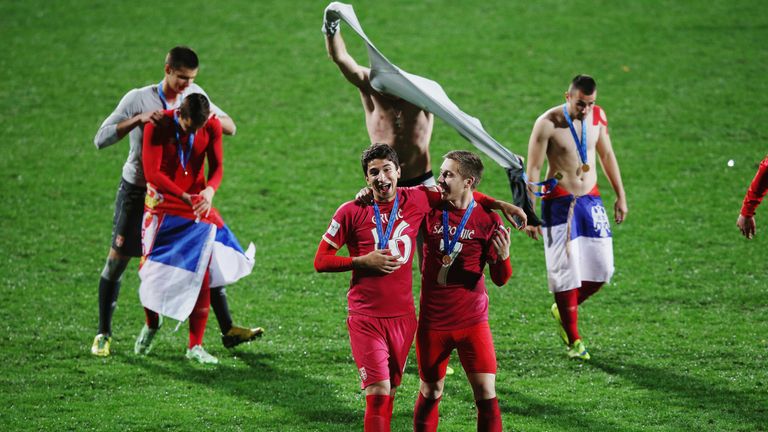 Grujic (L) celebrates with his Serbia U20 team-mates after winning the U20 World Cup in Auckland