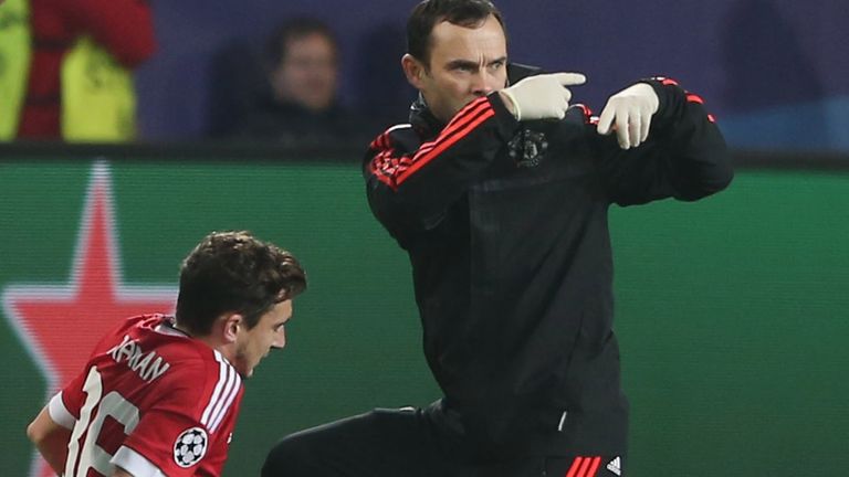 Matteo Darmian of Manchester United receives treatment before exiting the game