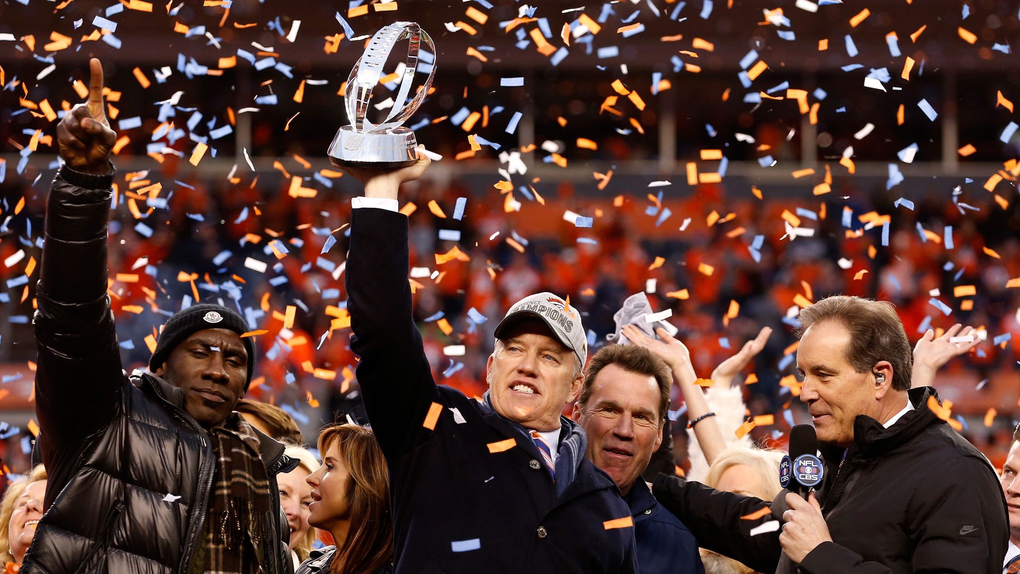 John Elway of the Denver Broncos holds up the Vince Lombardi