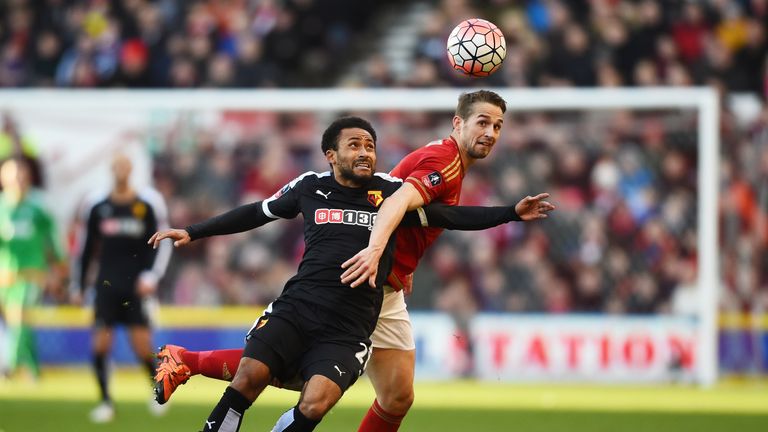 Ikechi Anya of Watford and Chris Cohen of Nottingham Forest compete for the ball