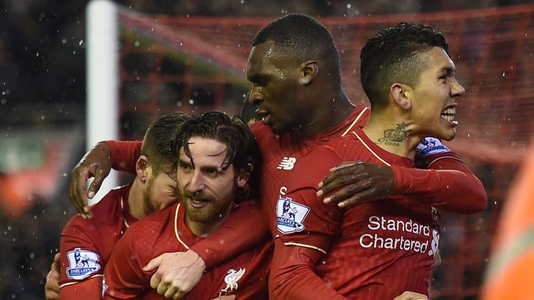 Joe Allen (left) celebrates as Liverpool and Arsenal play out a classic