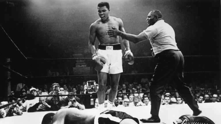 Muhammad Ali stands over Sonny Liston in their second fight