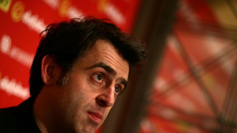 Ronnie O'Sullivan battled into the second round at the Crucible on Monday