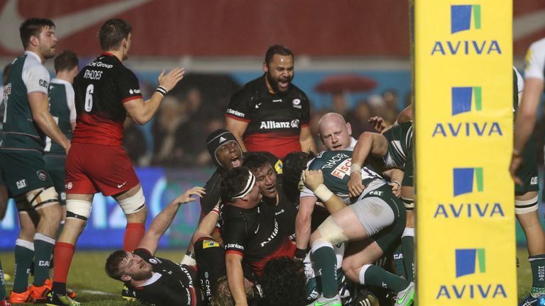 Saracens celebrate after referee Greg Garner awards them their second penalty try 