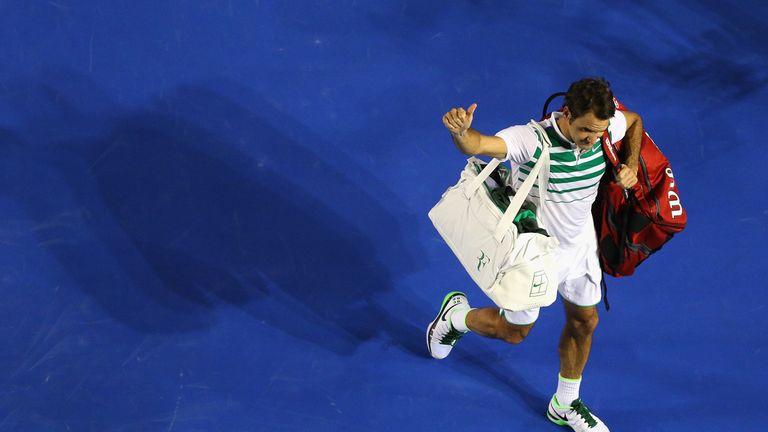 Roger Federer acknowledges the crowd after losing his semi-final against Novak Djokovic