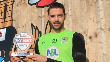 Image of Aaron Martin with his Sky Bet Football League Unsung Hero award