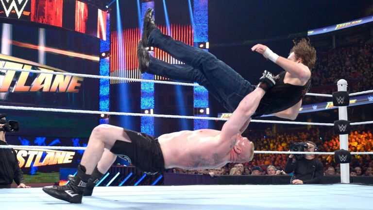 Brock Lesnar dishes out a German Suplex to Dean Ambrose