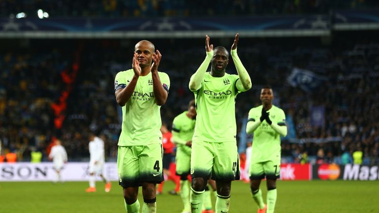 Vincent Kompany and Yaya Toure applaud the travelling Manchester City fans