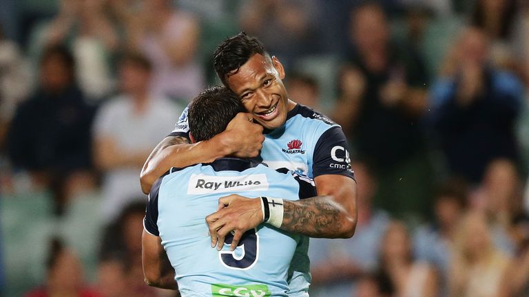 Nick Phipps and Israel Folau celebrate a Waratahs' try in their win over the Reds