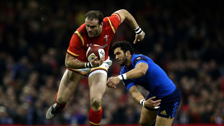 Jamie Roberts of Wales evades the tackle from Maxime Mermoz