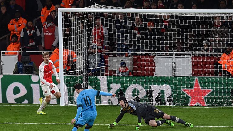 Lionel Messi shoots past Petr Cech to score the first goal in the Barcelona's 2-0 win