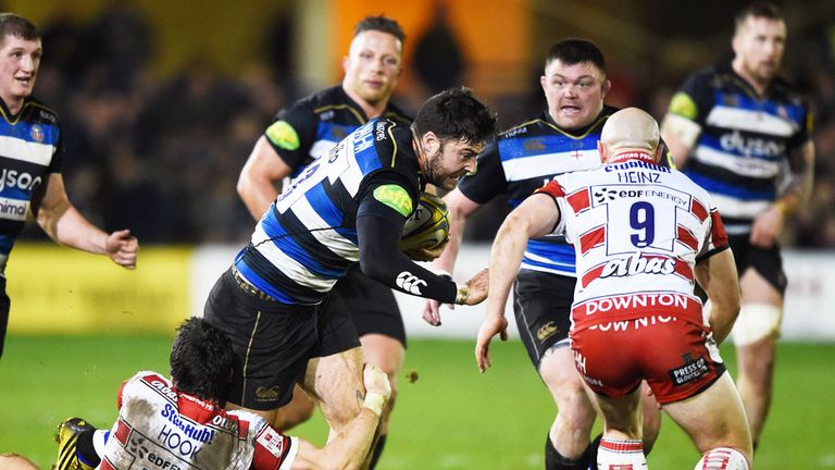 Matt Banahan of Bath is tackled by Gloucester's James Hook