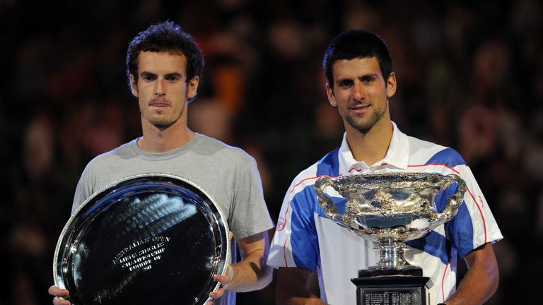 Djokovic holds the winner's trophy after beating Murray in 2011